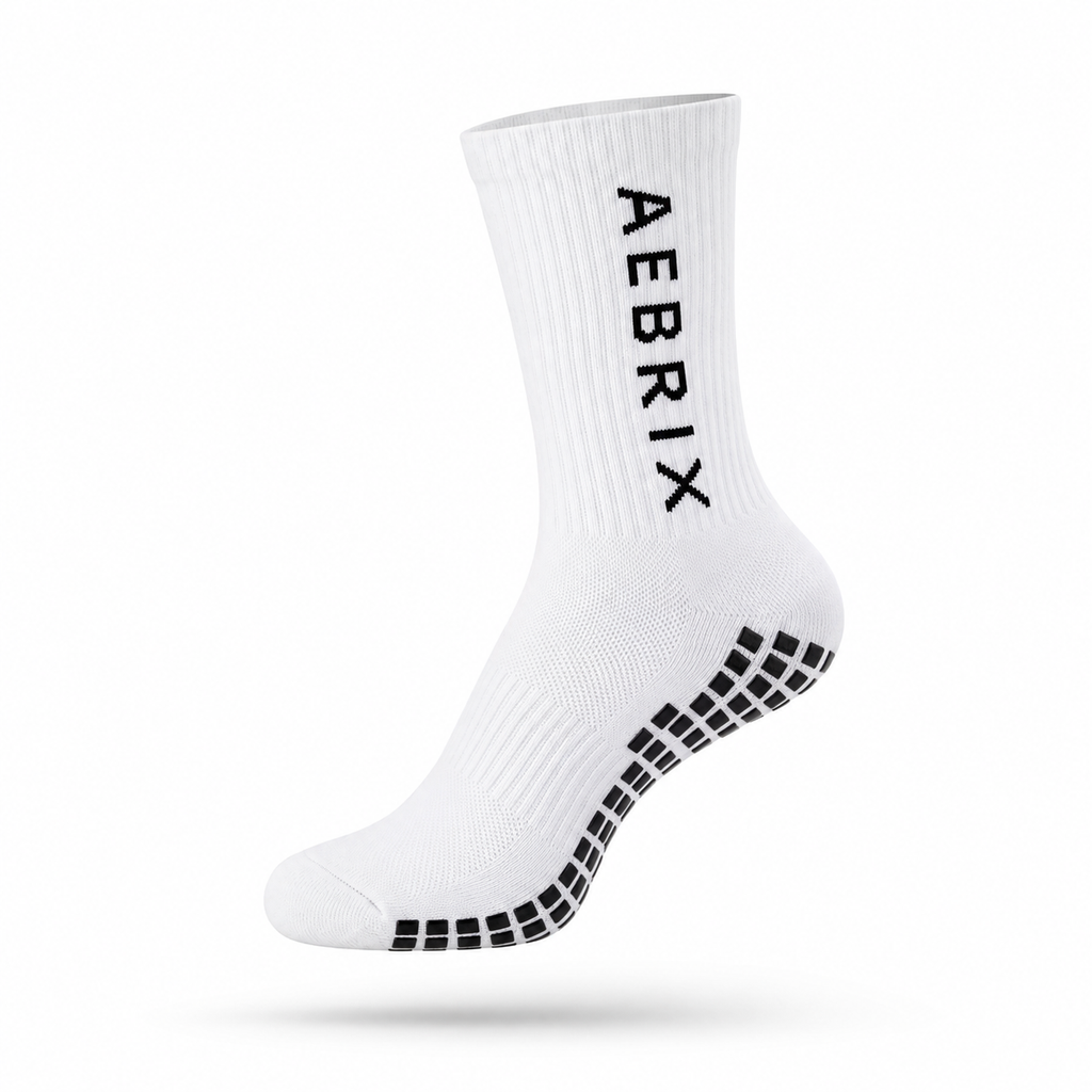 A single white crew sock with black grip dots on the sole and the brand name 'AEBRIX' printed vertically in black on the side, shown against a plain white background.